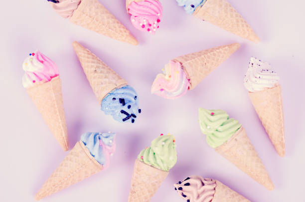 mini ice cream meringues in pastel colors, pattern abstract on pink background