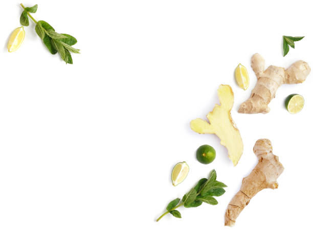 istock Composition of a pattern from a root of ginger, lemon, lime, mint, isolated on a white background 895336410