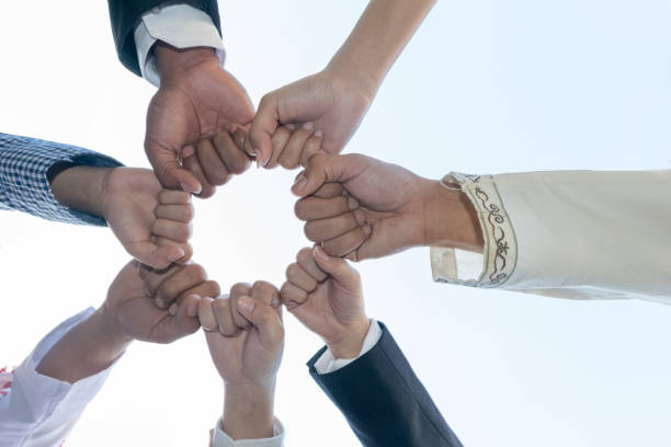 istock Diverse People Hands Fists Together Partnership 895341120