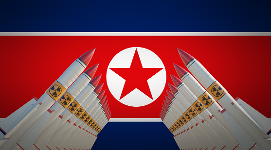 Nuclear missiles isolated over North Korean flag. Horizontal composition with copy space.  Nuclear war concept.