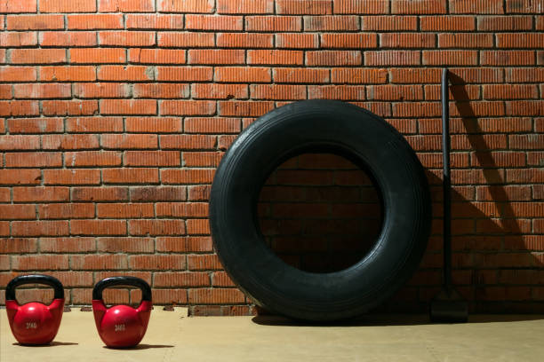 istock set of cross training in the gym on a brick wall background 895409894