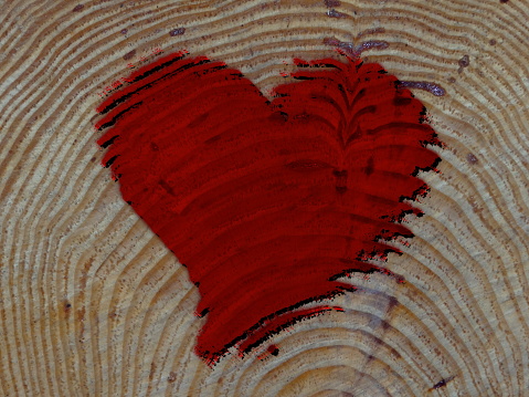 Wooden heart on black background