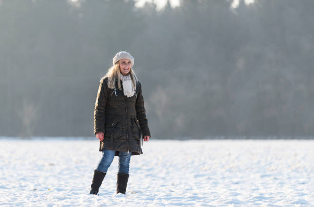 istock Walking in the snow on a sunny winter day 895427638