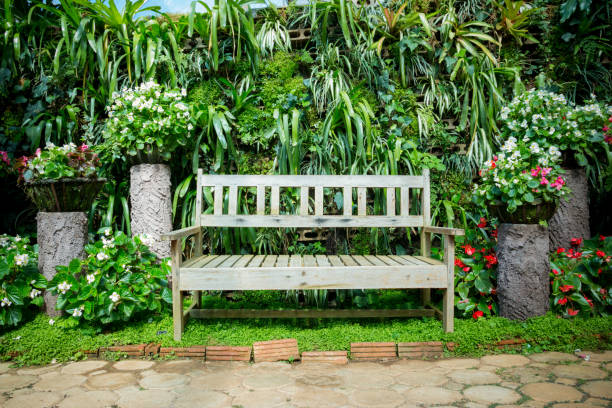 Art, Benches and Flowers in English Garden stock photo