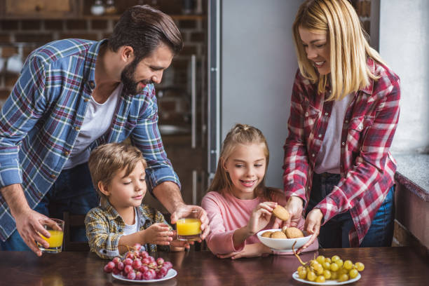 istock family having breakfast at home 895437584