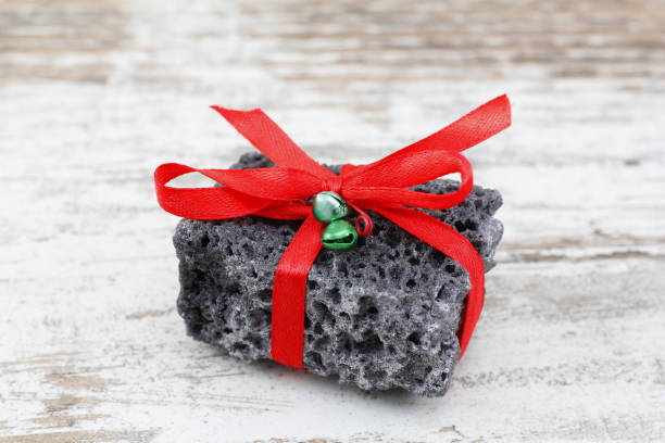 istock Christmas coal in a wood background 895437636