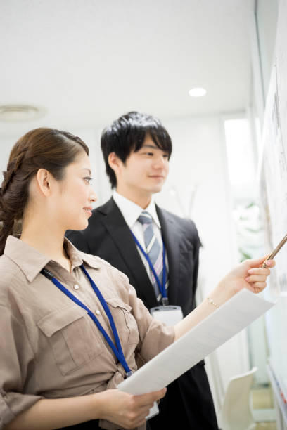 istock Image of the meeting (whiteboard · male · female) 895447882