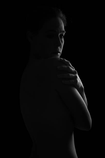 istock Body scape of woman back in low light with emotion artistic conversion 895448142