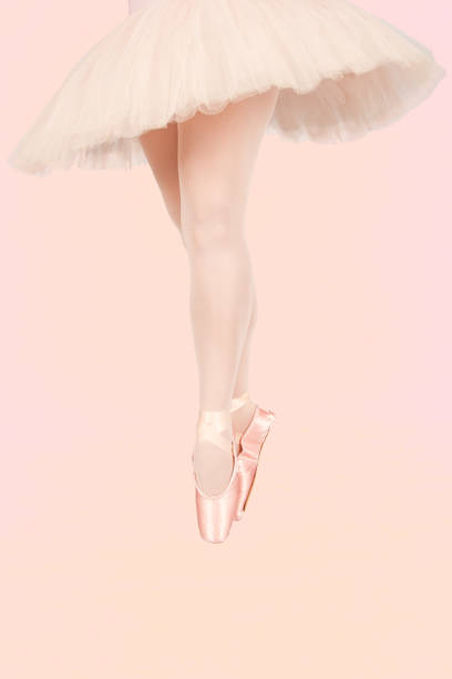istock Ballet dancer standing on colourful floor while dancing in pink tutu artistic converion 895450794
