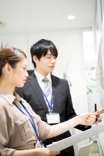 istock Image of the meeting (whiteboard · male · female) 895453998