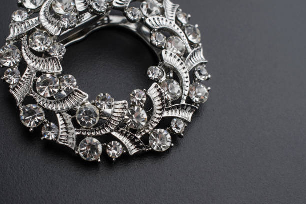istock round brooch with diamonds isolated on black 895454286