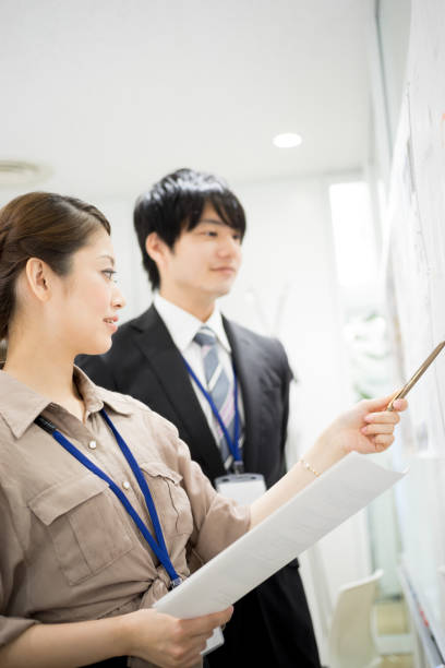istock Image of the meeting (whiteboard · male · female) 895454584
