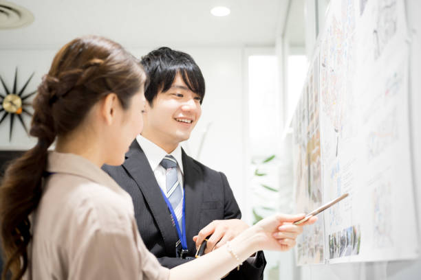 istock Image of the meeting (whiteboard · male · female) 895459374