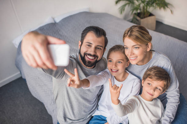 istock family taking selfie 895459416