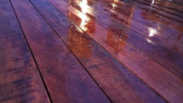 istock My Street - building reflection at wood floor 895460030