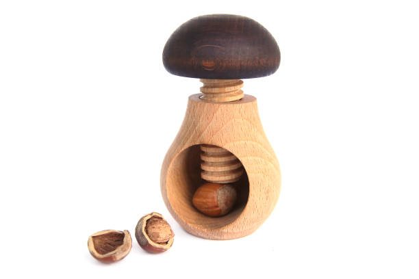 istock Wooden mushroom shape nutcracker isolated on white background. 895462906