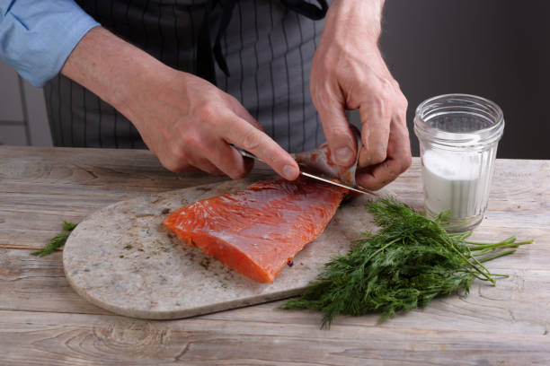 istock Removing skin from salted salmon 895463092