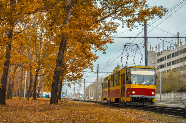 istock Old tram ride slowly through the autumn city 895465626