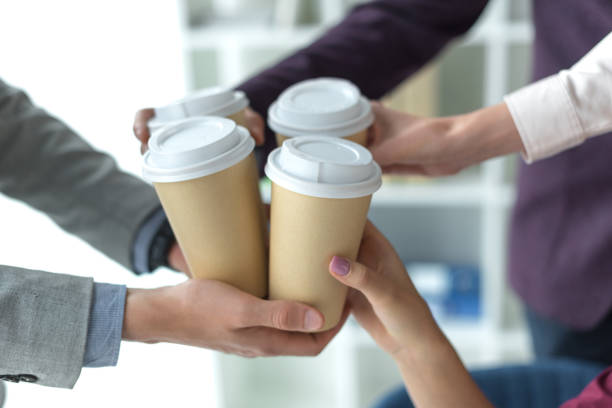 istock business partners clinking coffee cups 895466268