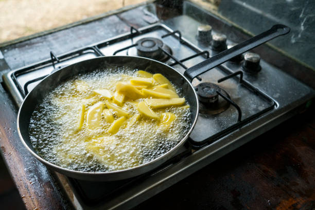 frying potatoes, sliced fries - food prepared potato vegetable healthy eating imagens e fotografias de stock