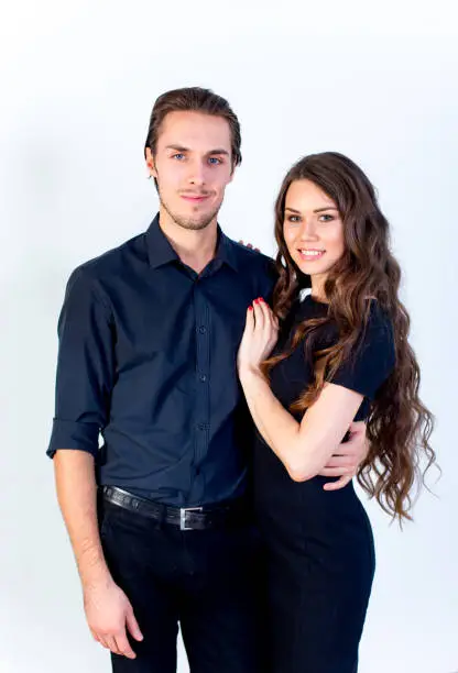 A portrait of a happy couple lovestory in a studio