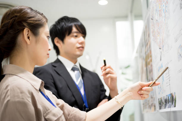 istock Image of the meeting (whiteboard · male · female) 895471938