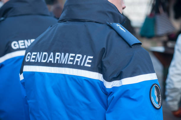 french gendarmes patrolling at the christmas market stock photo