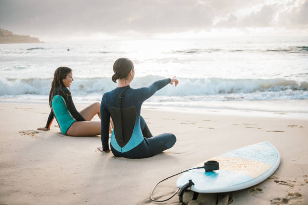 istock Finding perfect spot for riding the waves on surfboard 895510296