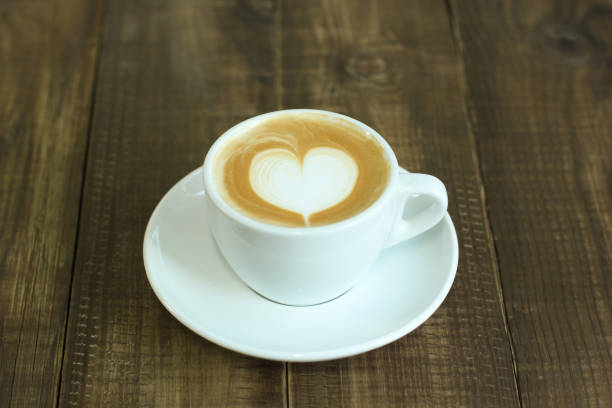 istock The coffee latte on wooden table 895515540