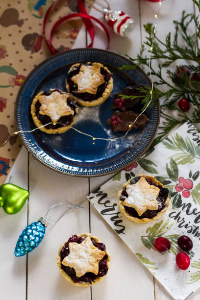 istock Mincemeat pies. Christmas decorations. Cranberries. White background. 895523330