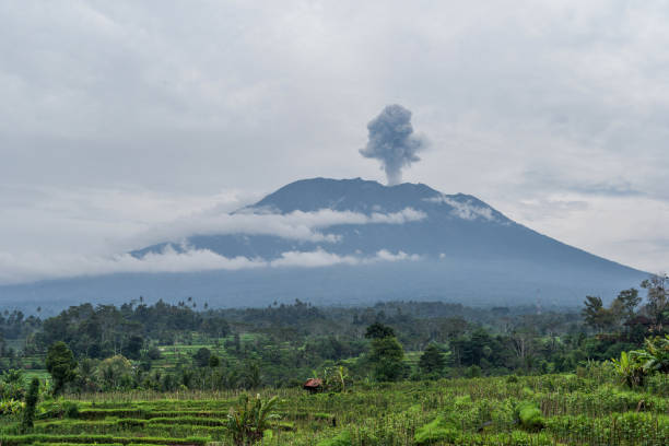 istock Agung volcano eruption view near rice fields, Bali, Indonesia 895523378