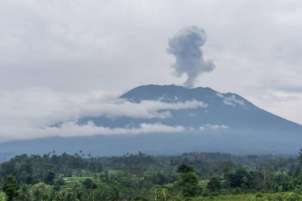istock Agung volcano eruption view near rice fields, Bali, Indonesia 895523398