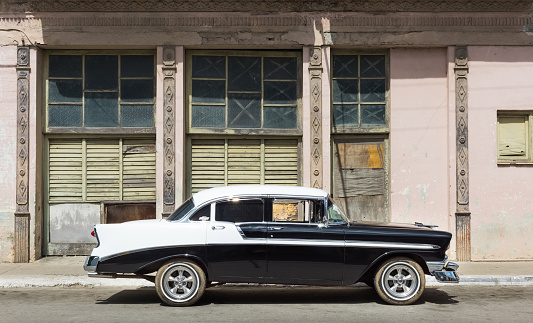 Santa Clara: Parked american blue white Chevrolet on the street in Santa Clara Cuba - Serie Cuba Reportage
