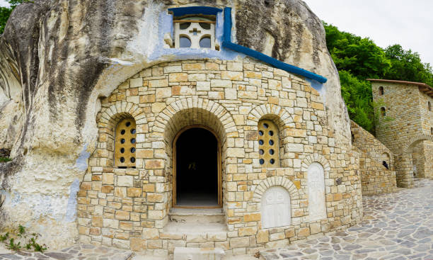 istock Entrance to the ancient Lyadovsky rock monastery 895525118