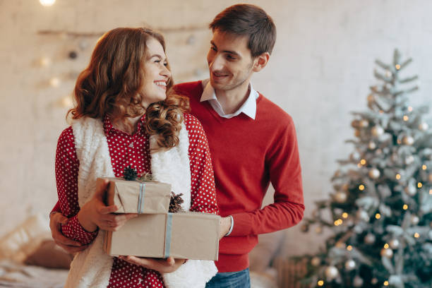 istock Happy couple with Christmas presents 895531020