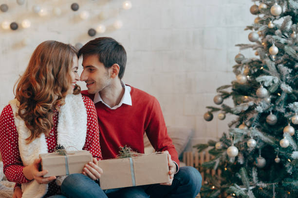 istock Happy couple with Christmas presents 895533862