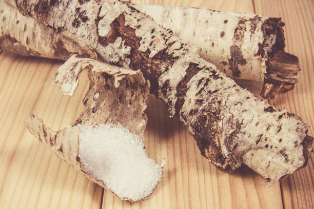 istock Xylitol - sugar substitute. Birch sugar on wooden background. 895535076