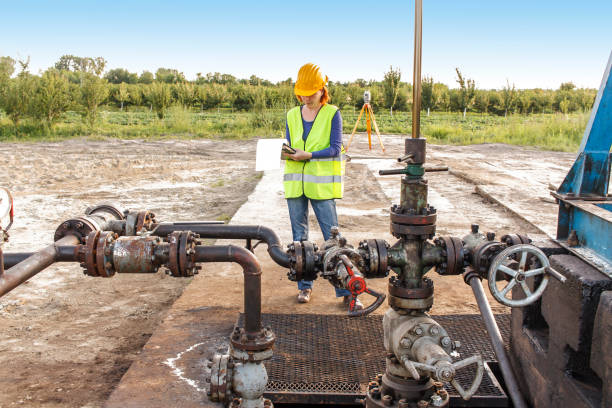 istock Woman engineer at oil field 895537996