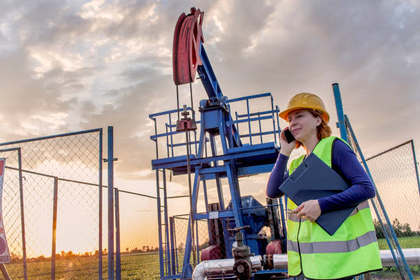 istock Woman engineer at oil field 895542228