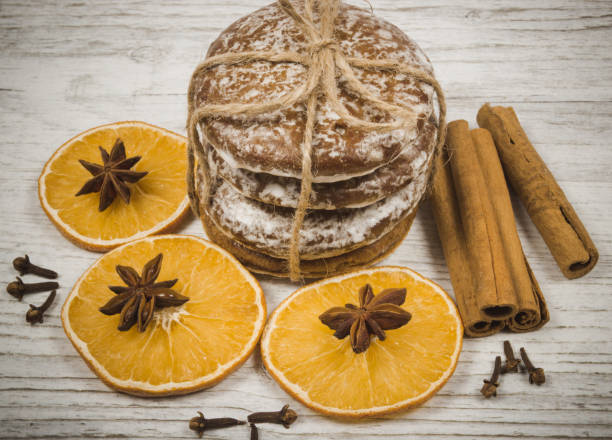 istock Gingerbread cookies, cinnamon and orange slices. Christmas decoration. 895542766