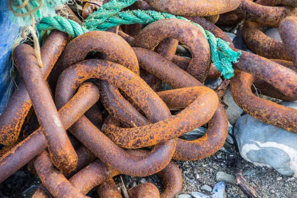 Photo of Rusty Chains on a beach