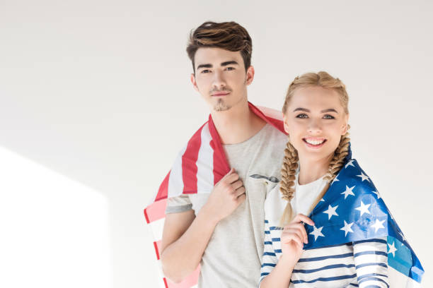 istock young couple with american flag 895544366