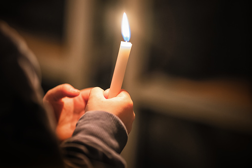 Kids are handling candles in the traditionall dresses. Celebration of Lucia day in Sweden