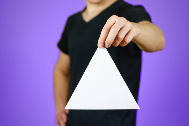 istock Man showing blank white triangular flyer brochure booklet. Leaflet presentation. Pamphlet hold hands. Man show clear offset paper. Sheet template. Booklet design sheet display read first person 895566274