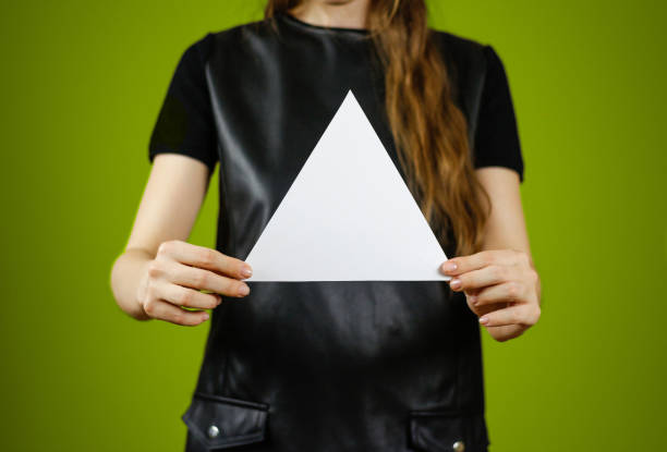istock Girl showing blank white triangular flyer brochure booklet. Leaflet presentation. Pamphlet hold hands. Woman show clear offset paper. Sheet template. Booklet design sheet display read first person 895568668
