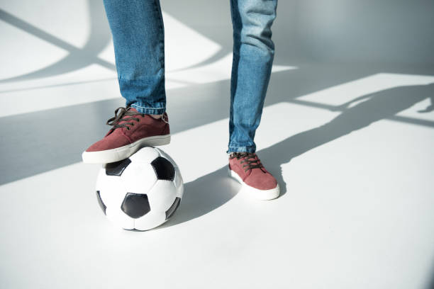 istock young man with soccer ball 895572064