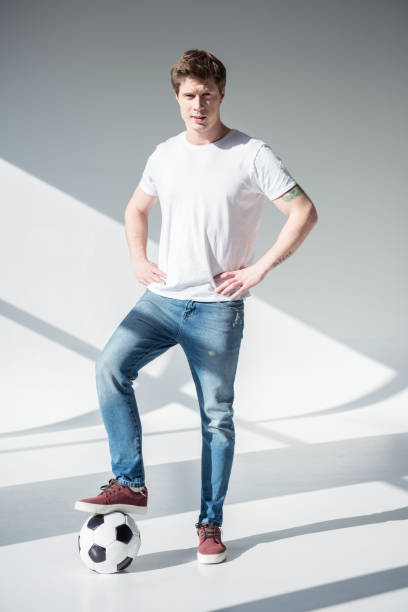 istock young man with soccer ball 895574782
