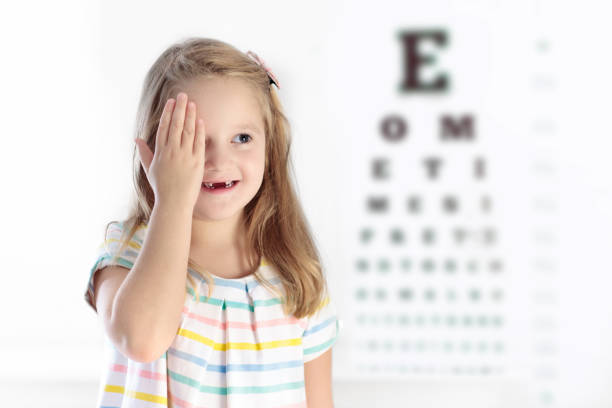 istock Child at eye sight test. Kid at optitian. Eyewear for kids. 895577368