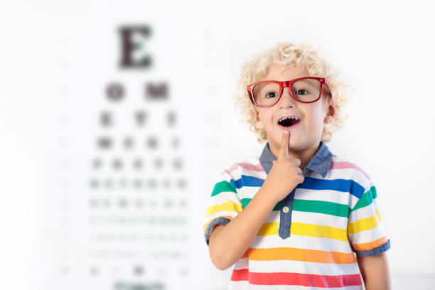 istock Child at eye sight test. Kid at optitian. Eyewear for kids. 895584046