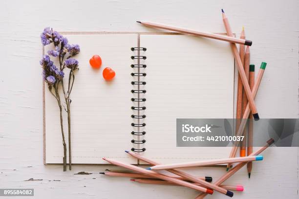 Open Sketchbook And Pencil On Old White Wooden Table Stock Photo - Download Image Now